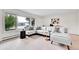 Bright living room with large window and neutral decor at 7076 S Spruce W Dr, Centennial, CO 80112