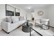 Cozy living room featuring modern decor, neutral-toned furniture, and ample natural light at 7076 S Spruce W Dr, Centennial, CO 80112