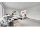 Spacious living room featuring stylish sectional sofa and neutral carpet at 7076 S Spruce W Dr, Centennial, CO 80112