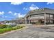 Commercial building featuring the Pindustry business with parking and outdoor seating at 7076 S Spruce W Dr, Centennial, CO 80112