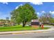 Walnut Hills Elementary School featuring a large grassy lawn and outdoor play area at 7076 S Spruce W Dr, Centennial, CO 80112