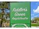 Fiddler's Green amphitheater signage with a map detailing entrances, lawn seating, and amenities at 7076 S Spruce W Dr, Centennial, CO 80112