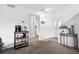 Clean entryway with a coffee bar, closet space, and a decorative table with plant at 13228 E Asbury Dr, Aurora, CO 80014