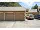 Two brown single-car garages are shown in the image at 13228 E Asbury Dr, Aurora, CO 80014