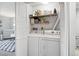 Practical laundry room with shelving, a washer, and a dryer for efficient laundry care at 13228 E Asbury Dr, Aurora, CO 80014
