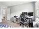 Functional office with dual monitors and organized storage, bathed in natural light at 13228 E Asbury Dr, Aurora, CO 80014