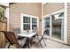 Private patio has table and four chairs, plus sliding door to the home's interior at 13228 E Asbury Dr, Aurora, CO 80014