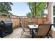 Private patio with outdoor seating and grill perfect for entertaining and relaxation at 13228 E Asbury Dr, Aurora, CO 80014