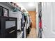 Organized walk-in closet features custom shelving and a cedar plank accent wall at 13228 E Asbury Dr, Aurora, CO 80014