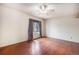 Inviting bedroom with a ceiling fan, hardwood floors and natural light at 3593 S Kittredge St # E, Aurora, CO 80013
