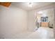 Open dining area leading to a bright kitchen equipped with stainless steel appliances at 3593 S Kittredge St # E, Aurora, CO 80013