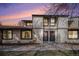 Charming townhouse showcasing a well-maintained exterior with two front doors and sunset backdrop at 3593 S Kittredge St # E, Aurora, CO 80013