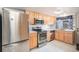 Efficient kitchen featuring stainless steel appliances and light wood cabinetry at 3593 S Kittredge St # E, Aurora, CO 80013