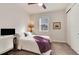 Cozy bedroom with window, carpeted floor, and a desk at 2615 Mayotte Way, Castle Rock, CO 80109