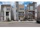 Three-story townhouses with modern design, featuring neutral color palettes and balconies at 2615 Mayotte Way, Castle Rock, CO 80109