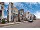 Row of contemporary townhouses showcasing sleek architecture and outdoor space at 2615 Mayotte Way, Castle Rock, CO 80109