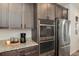 Stainless steel appliances and ample cabinetry in this kitchen at 2615 Mayotte Way, Castle Rock, CO 80109