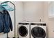 Laundry room with washer, dryer, and hanging rack at 2615 Mayotte Way, Castle Rock, CO 80109