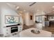 Open-concept living room with a view into the modern kitchen at 2615 Mayotte Way, Castle Rock, CO 80109