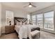 Spacious main bedroom with large windows and plush bedding at 2615 Mayotte Way, Castle Rock, CO 80109