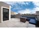 Relaxing rooftop deck with seating area and city views at 2615 Mayotte Way, Castle Rock, CO 80109