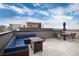 Spacious rooftop deck with seating area, fire pit, and city views at 2615 Mayotte Way, Castle Rock, CO 80109