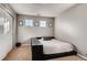 Clean bedroom with pull out bed and carpet flooring, complete with natural light at 10480 Skyreach Rd, Highlands Ranch, CO 80126