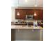 Well-lit kitchen featuring granite countertops, stainless steel appliances, and stylish pendant lighting at 10480 Skyreach Rd, Highlands Ranch, CO 80126