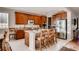 Spacious kitchen with granite countertops, stainless steel appliances, and large center island at 10480 Skyreach Rd, Highlands Ranch, CO 80126