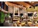 Stunning living room with stone fireplace, high ceilings, and contemporary chandelier lighting at 10480 Skyreach Rd, Highlands Ranch, CO 80126