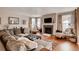 Spacious living room featuring a fireplace, hardwood floors, and comfortable seating at 10480 Skyreach Rd, Highlands Ranch, CO 80126