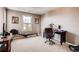 Bright home office with large window, neutral carpeting, and modern exercise equipment at 10480 Skyreach Rd, Highlands Ranch, CO 80126