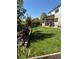 Beautiful landscaped backyard with lush green lawn and a charming wooden fence at 16706 E Black Horn Dr, Parker, CO 80134