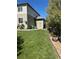 Exterior view featuring a well-maintained lawn and access to the home's side entrance at 16706 E Black Horn Dr, Parker, CO 80134