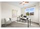 Bright office with a modern desk, chair, and ample natural light from the window at 16706 E Black Horn Dr, Parker, CO 80134