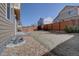Large grassy backyard surrounded by a tall wooden fence, offering privacy and space at 3164 S Kirk Way, Aurora, CO 80013