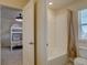 Full bathroom with tiled tub and shower combination with neutral finishes at 3164 S Kirk Way, Aurora, CO 80013