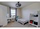 Bright bedroom with neutral walls, a window, and a modern ceiling fan at 3164 S Kirk Way, Aurora, CO 80013