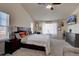 Cozy bedroom with vaulted ceilings, a ceiling fan, and a large window at 3164 S Kirk Way, Aurora, CO 80013