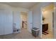 Bedroom with closet, adjacent bathroom, and decorated with modern painting and woven basket at 3164 S Kirk Way, Aurora, CO 80013