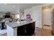 Modern kitchen island features granite countertops and dark wood cabinetry at 3164 S Kirk Way, Aurora, CO 80013