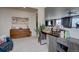 Comfortable living room with stylish decor, a decorative wall, and an open layout at 3164 S Kirk Way, Aurora, CO 80013