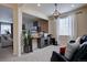 Cozy sitting area with modern decor, a decorative wall, and views into another room at 3164 S Kirk Way, Aurora, CO 80013