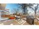 Enjoy outdoor living on this deck with a hot tub, dining table, and grill, backing onto a fenced yard at 17588 E Dickenson Pl, Aurora, CO 80013