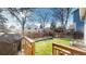 Well-maintained backyard featuring lush green grass and a wooden fence for privacy at 17588 E Dickenson Pl, Aurora, CO 80013