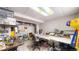 Finished basement with shelving and a large table for activities in this single Gathering home at 17588 E Dickenson Pl, Aurora, CO 80013