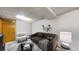Basement living room featuring a modern couch and chair, and neutral decor at 17588 E Dickenson Pl, Aurora, CO 80013