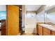 Bathroom featuring a shower, a soaking tub, and a well-lit vanity area at 17588 E Dickenson Pl, Aurora, CO 80013