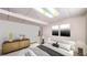 Bedroom with a large bed, two framed pictures, and bedside tables with lamps in this house at 17588 E Dickenson Pl, Aurora, CO 80013