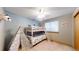 bedroom featuring a white bunk bed, teepee, and gray-blue walls at 17588 E Dickenson Pl, Aurora, CO 80013